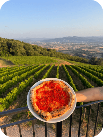 Baking traditional pizza during a winery cooking experience