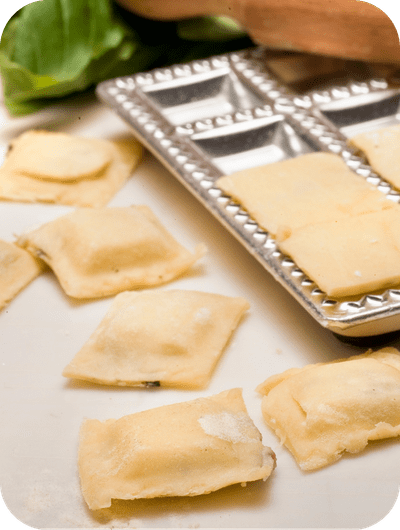 Fresh handmade ravioli prepared during a pasta making class in Umbria