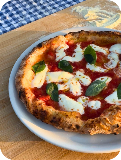 Homemade pizza prepared in an Umbrian cooking class