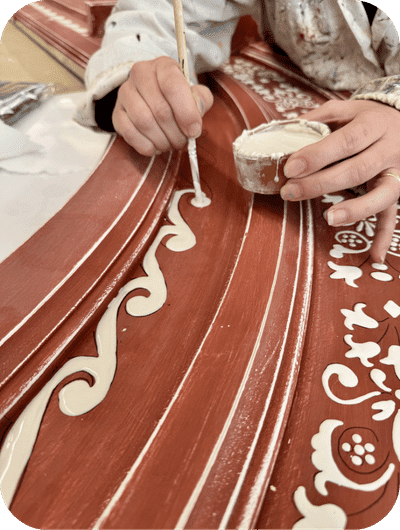 Detail of a brush painting by hand using traditional techniques in an Umbrian art workshop