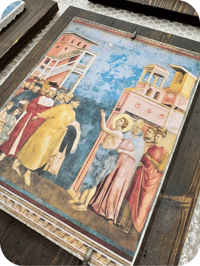 Hand-painted fresco reproduction depicting the life of Saint Francis inside an artisan workshop in Umbria